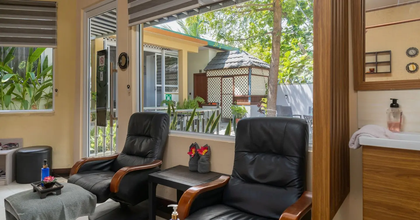 Nala Veli Beach & Spa spa lounge — a frame from the property shoot, natural light, garden view